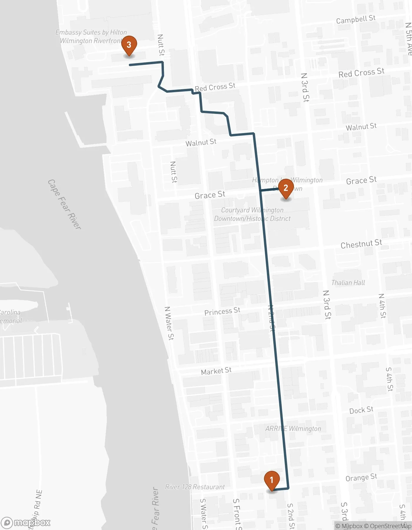 Walking map of three downtown Wilmington museums. Numbered pins show the Children's Museum on Orange Street, Cape Fear Museum on Grace Street, and the Railroad Museum on Nutt Street, with a walking route connecting them.